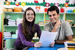 Educational Advocacy image of a young women and young man sitting at a table in a classroom setting