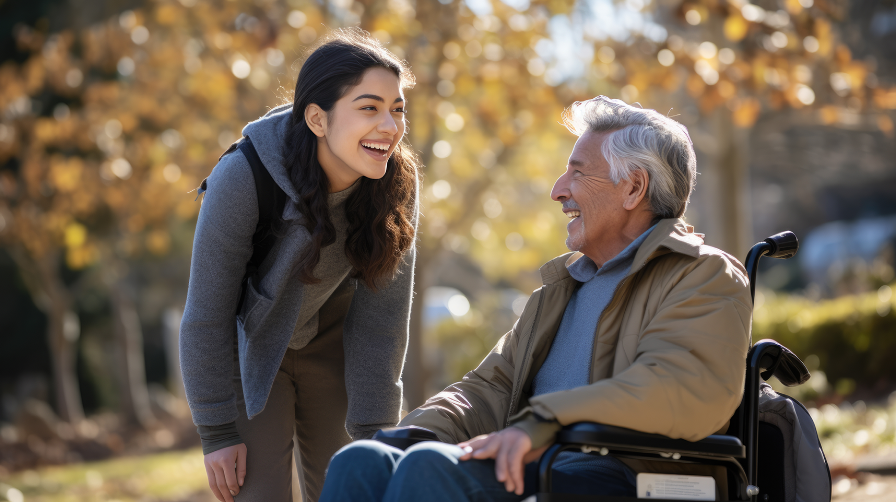 Woman speaks with an elder in wheelchair